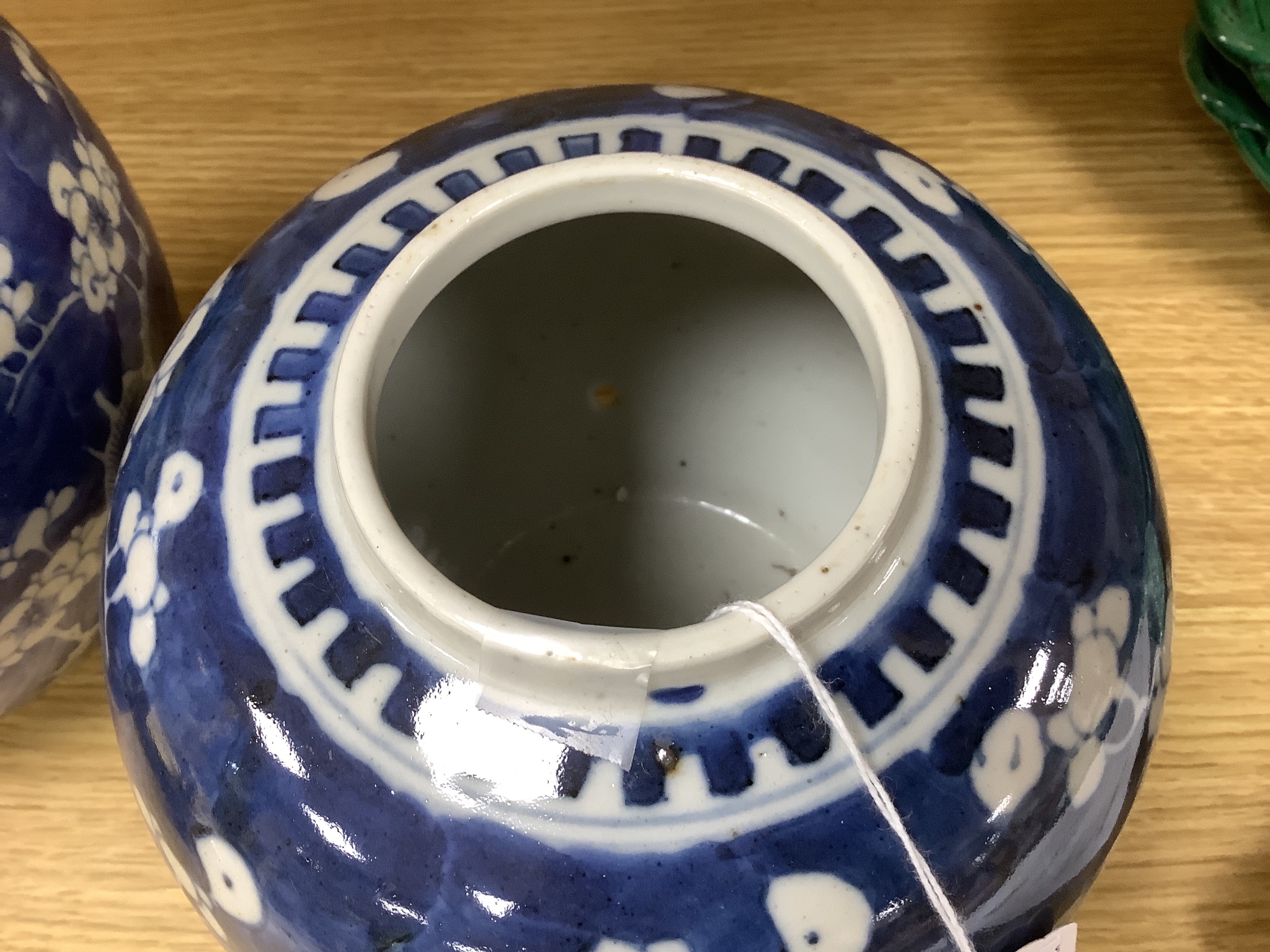 Two early 20th century Chinese blue and white prunus jars, tallest 16cm